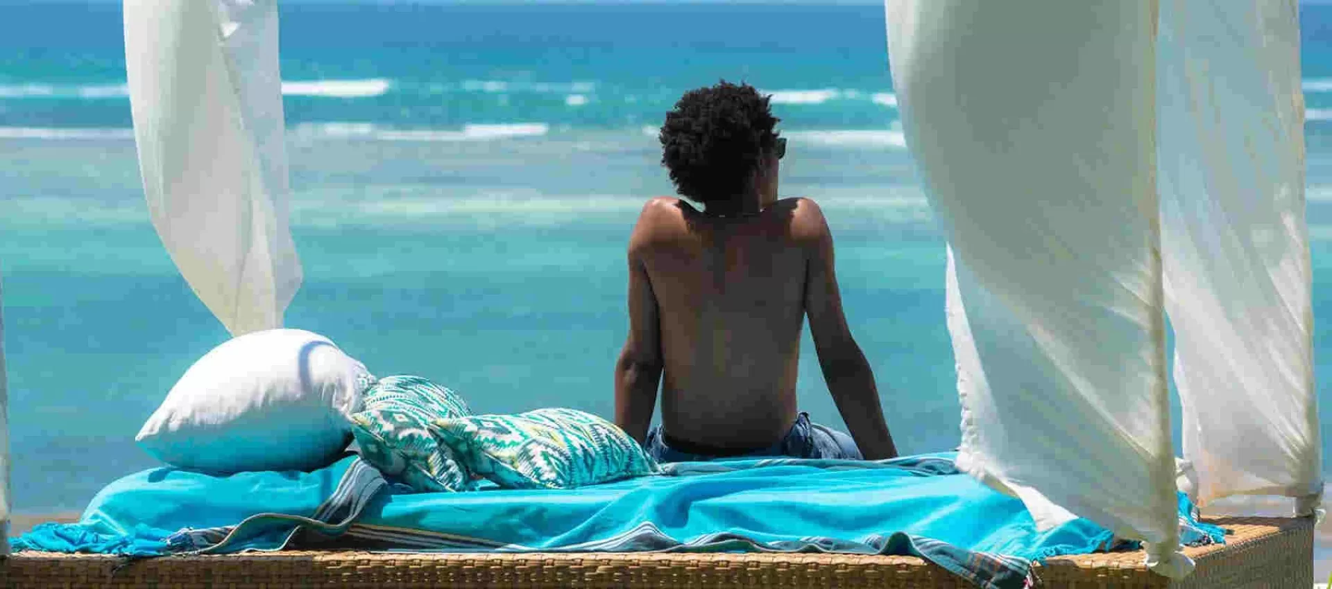Calm oceanfront daybed scene for a Nyali beach stay